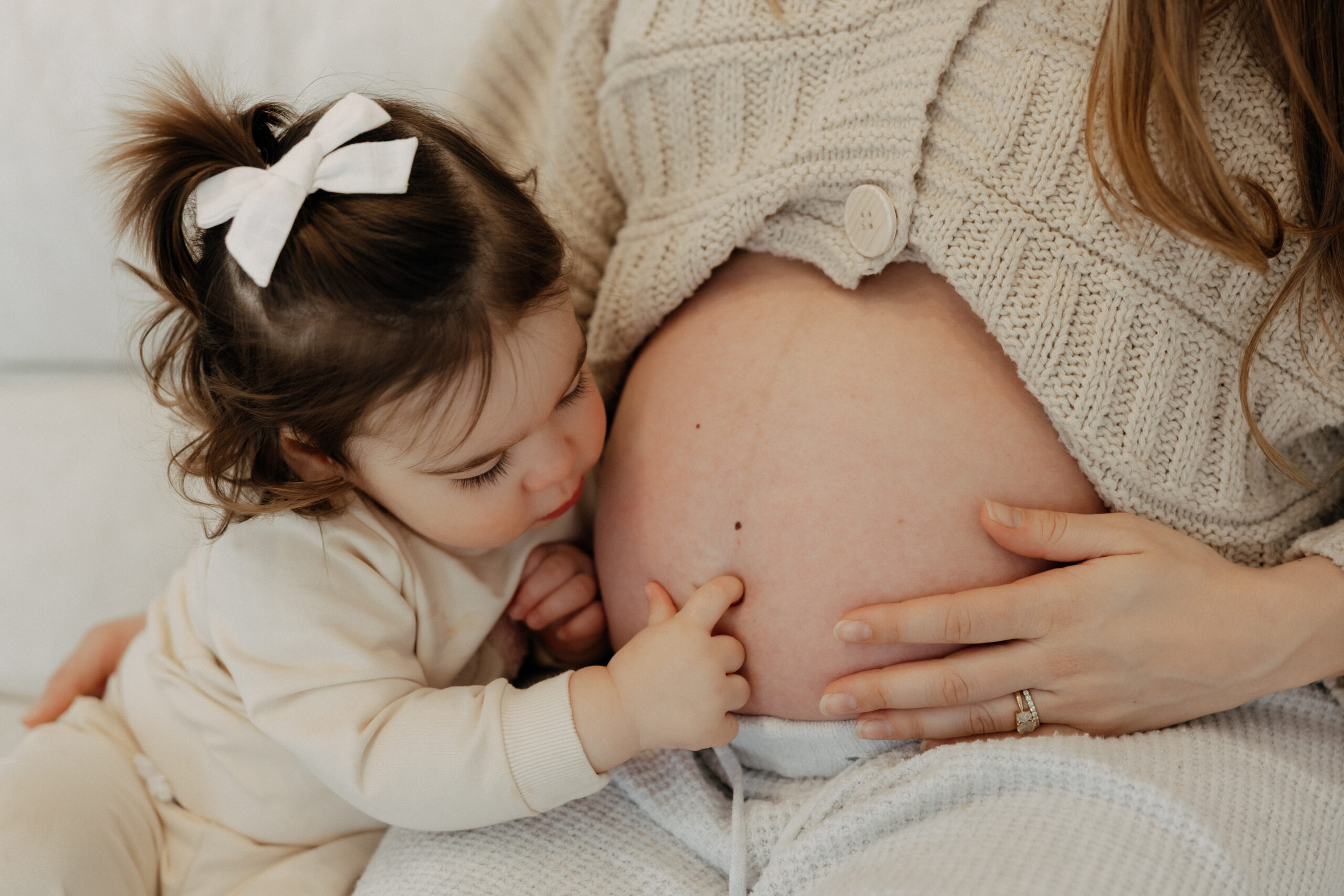 Pregnant mother in white studio maternity session Beverly MA